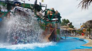Water splashing in front of a giant pirate and water slides at Corfu Water Park.