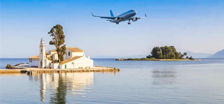 A plane taking off and flying over Pontikonisi, Corfu.